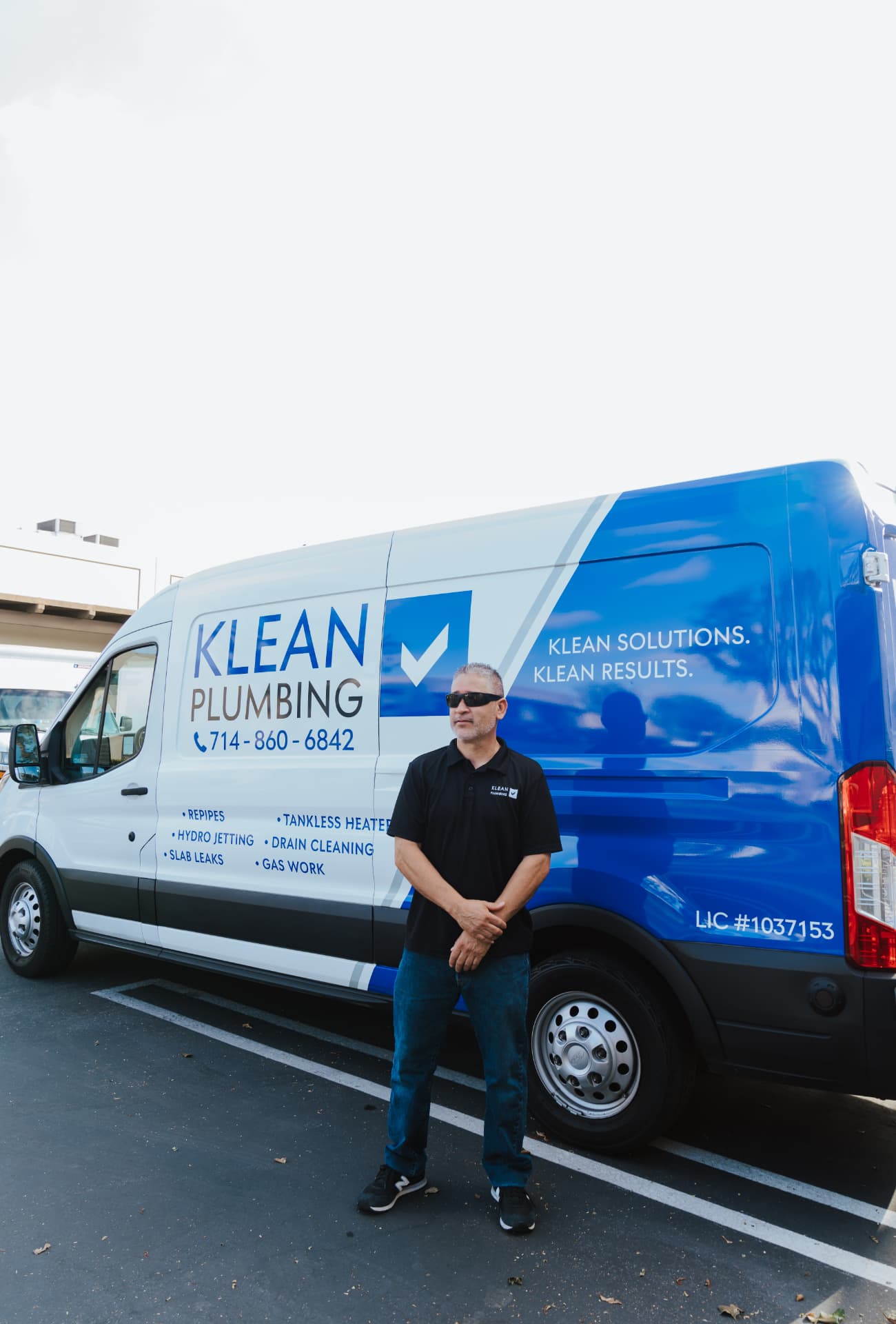 Klean Plumbing owner standing in front of a Klean Plumbing service van today